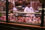 Butchers preparing counter
