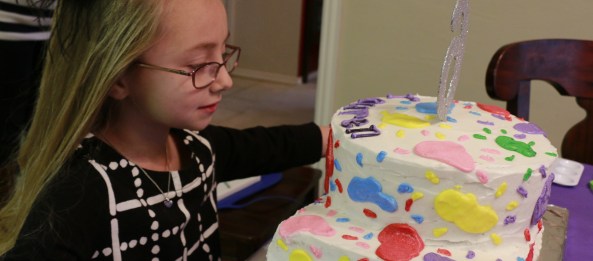 Lauren looking at her cake
